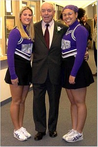 Walter Simcock and his escorts, two Waterville High School cheerleaders, at the awards ceremony.