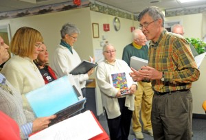 Soothe Souls: Harry Vayo, head of the Tourmaline Singers, directs the choir during a performance at the Augusta Center for Health and Rehabilitation. Staff photo by Michael G. Seamans 